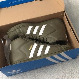 Olive green high top Adidas